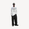 Balenciaga Herren | NBA-Kollaboration: Oversize-Langarm-T-Shirt in Weiß/Mehrfarbig Balenciaga Herren | NBA-Kollaboration: Oversize-Langarm-T-Shirt in Weiß/Mehrfarbig