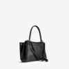 Damen-Handtasche „Rodeo“ klein mit Anhängern in Schwarz Damen-Handtasche „Rodeo“ klein mit Anhängern in Schwarz