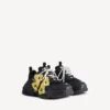 Damen-Sneaker „Triple S Tape Type“ in Schwarz/Gelb Damen-Sneaker „Triple S Tape Type“ in Schwarz/Gelb